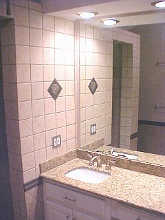 vanity with tile and medallion
